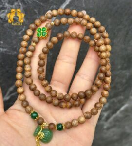 Vòng trầm hương 108 hạt rừng tự nhiên mix charm túi tiền